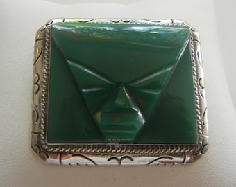 Sterling silver & carved green onyx warrior brooch 33 grams 2" x 1-1/2".  Onyx and silver warrior's mask brooch.  Large Aztec mask brooch.