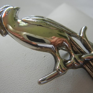 Large Bird of Paradise sterling silver brooch 7.8 grams 2-3/4&quot;x 1-1/4&quot;.  Vintage bird of paradise brooch.  Large detailed silver bird brooch