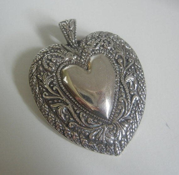 Large Andrea Barnett repousse heart within a hear… - image 1
