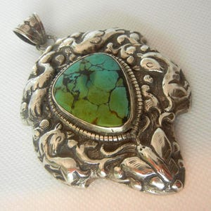 Huge 4&quot; Tibetan 900 silver & turquoise repousse pendant 59.7grams. Tibetan jewelry.  Double sided animal turquoise pendant.  Tibet turquoise