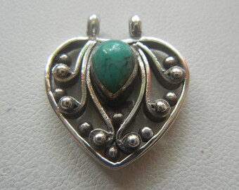 Turquoise & sterling silver heart pendant from Bali 2.7 grams.  Small heart pendant.  Silver and turquoise heart pendant.  Heart jewelry.