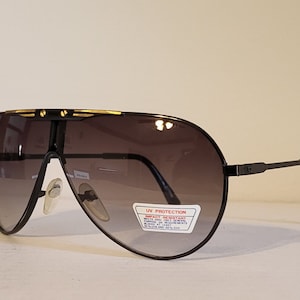 Vintage Aviator Sunglasses // Black metal frames // Gold decal on brow of frames // Gradient Lens // Pilot Airforce shades //  NOS