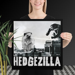 May include: A black and white poster with a hedgehog standing in front of a city skyline. The hedgehog is blowing smoke from its nose. The text "HEDGEZILLA" is at the bottom of the poster.