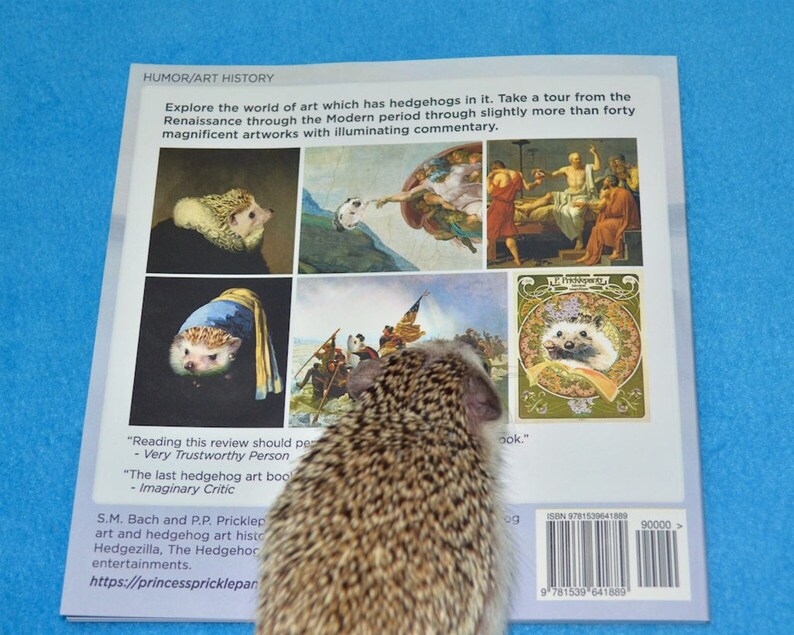 May include: The back cover of a book titled "Humor/Art History" featuring a hedgehog on the cover. The book cover features several images of famous paintings with hedgehogs replacing the original subjects. The book cover also includes the book's title, author, and ISBN number.