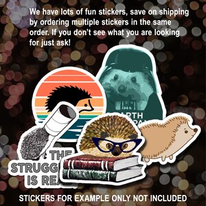 May include: A collection of stickers featuring various designs of hedgehogs. The stickers include a hedgehog wearing glasses, a hedgehog in a retro sunset scene, a hedgehog wearing a Darth Vader helmet, and a hedgehog with a book stack. The text "The struggle is real" is also included on one of the stickers. The text "Stickers for example only not included" is at the bottom of the image.