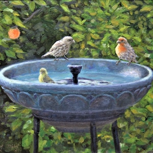May include: A blue bird bath with a fountain in the center. Three birds are perched on the rim of the bird bath. One bird is yellow, one is brown, and one is orange and brown.