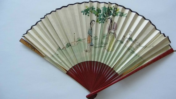 Japanese fan. Early 20th. Double-sided decorations