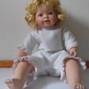 Vintage doll. Artist doll. Full-scale. Numbered. Porcelain. Padded body fabric. Blond hair. 80&#39;s.