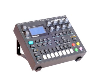 May include: Black Elektron Digitone synthesizer with a blue and white display screen, a row of knobs, and a grid of buttons. The synthesizer is mounted on a black metal stand.