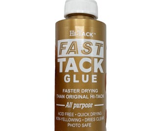May include: A gold-colored bottle of Hi-Tack Fast Tack Glue with a white nozzle. The label features bold white text and states it is acid-free, quick-drying, and photo-safe. The bottle contains 4 fl. oz.