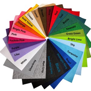 May include: A color chart of felt fabric swatches in various colors, including cream, gold yellow, orange, bright pink, pink, fuchsia pink, purple, lilac, white, silver grey, brown, wine, red, teal, bottle, emerald, grass green, bright lime, sky, turquoise, royal, midnight navy, black, dark marl grey, and marl grey.