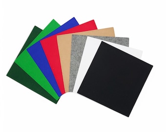 May include: Assortment of felt squares in various colors, including green, blue, red, beige, gray, white, and black.