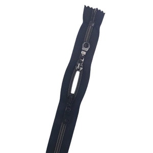 May include: A black zipper with a metal slider and a black tape. The zipper is open and the slider is in the middle of the tape.