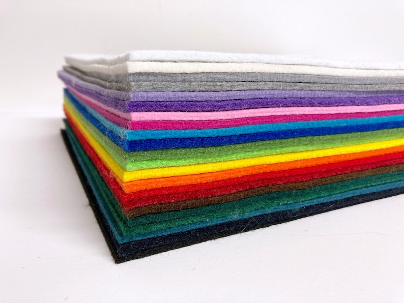 May include: A stack of 20 felt sheets in various colors, including white, gray, purple, pink, blue, green, yellow, orange, red, brown, dark green, teal, and black.