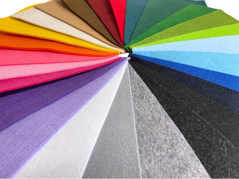 May include: A fan of 20 different colored felt fabric swatches arranged in a circle. The colors range from bright red to dark green.