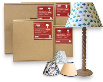May include: A wooden table lamp with a floral lampshade, alongside several cardboard boxes labeled "Conical Table Lamp Lampshade Making Kit" with sizes 25cm, 30cm, 45cm, and 50cm. Additional lampshades in various patterns are also visible.