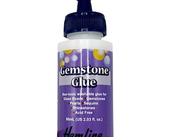 May include: A white bottle of Hemline Gemstone Glue with a dark blue cap. The label features the words "Gemstone Glue" and lists the glue's uses for glass beads, gemstones, pearls, sequins, and rhinestones. The bottle contains 60mL (US 2.03 fl. oz.) of glue.