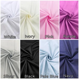 May include: A grid of eight fabric swatches in various solid colors, each gathered in the center to show texture. The colors are labeled as white, ivory, pink, purple, silver, black, pale blue, and navy, arranged in two rows of four.