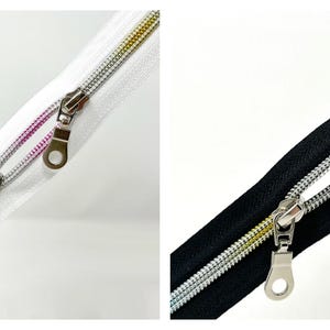 May include: Two silver zippers with colorful threads, one on a white background and one on a black background.