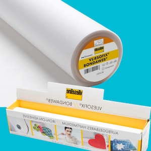 May include: A roll of white Vliesofix Bondawweb iron-on adhesive for crafts. The roll is labelled with the brand name Vlieseline and the product name Vliesofix Bondawweb. The label also includes instructions for use and a 100% PA composition.