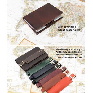 May include: A brown leather notebook cover with a built-in pencil holder. Additional pencil holders are available in various colors, including green, blue, burgundy, brown, and red.