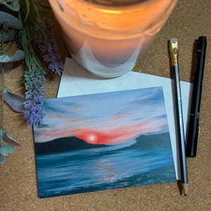 Tarjeta de felicitación de bellas artes: playa de Cornualles, cielo rojo por la noche