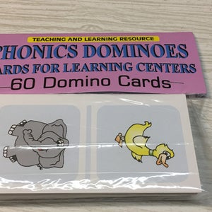 May include: A set of 60 phonics domino cards for learning centers. The cards feature colorful illustrations of an elephant and a duck. The text on the front of the package reads "Phonics Dominoes Cards for Learning Centers - 60 Domino Cards".