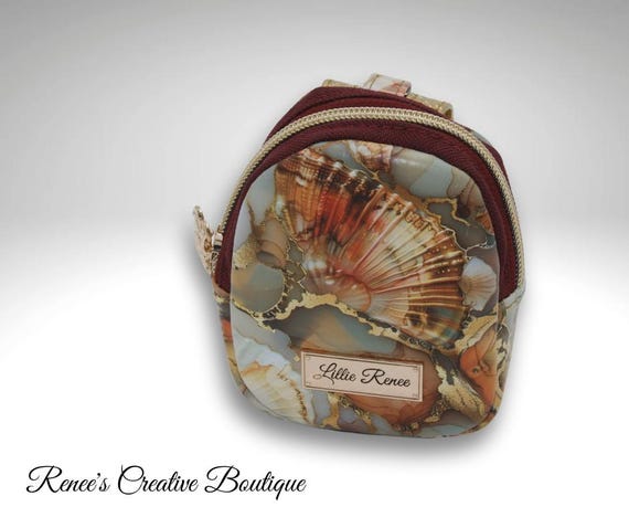 Small clip on backpack like bag to hold essentials. Clip on jeans, backpack, bike, etc