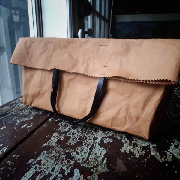 Fold over purse made from washable and reusable brown kraft paper. Vegan Leather bags as Clutch bag and Evening Bag