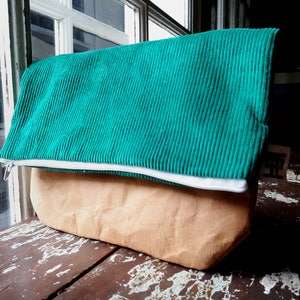 Fold over clutch bag made from washable kraft paper, vegan leather, and recycled fabric