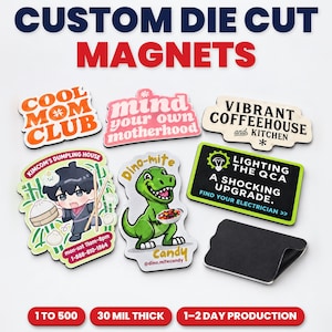 May include: A collection of custom die-cut magnets featuring various designs including Cool Mom Club, Mind Your Own Motherhood, Vibrant Coffeehouse and Kitchen, Kimcom's Dumpling House, Dino-mite Candy, and Lighting The QCA, with one blank black magnet.
