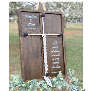 A Cord of Three Strands unity ceremony braided cord cross sign with White & Ivory cotton cords, non traditional unity ceremony ideas