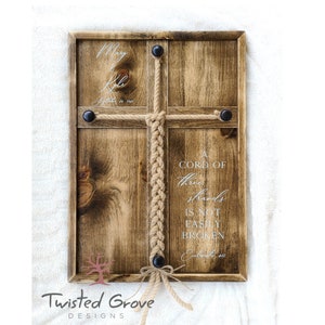 May include: A wooden plaque with a braided rope and the text "A cord of three strands is not easily broken. Ecclesiastes 4:12".