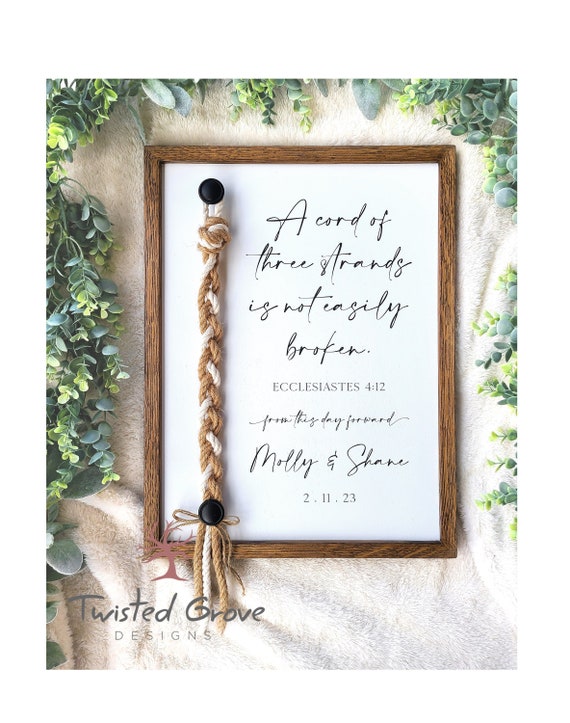 A Cord of Three Strands unity ceremony braided cord cross sign with natural white cotton and Jute cords, non traditional unity ceremony idea