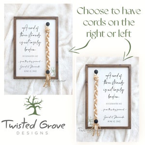 May include: A wooden sign with the text "A cord of three strands is not easily broken."  The sign also includes the text "Ecclesiastes 4:12", "from this day forward", "Jared & Sharanda", and "June 12, 2012".  The sign has a braided rope hanging from it.