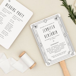 May include: Two white wedding fans with black text. The left fan lists the wedding party and the right fan says "Welcome to the wedding of Jennifer and Benjamin, September 20, 2023 | Victoria, BC, Canada".