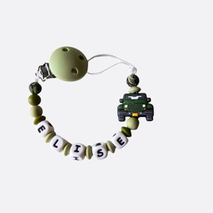 May include: A green and white silicone baby teether with a clip, beads, and a green jeep charm. The beads spell out the name "ELISE".