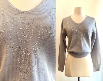 Maglione vintage con paillettes anni '70: maglia acrilica blu con scollo a V