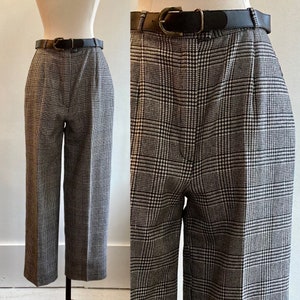 May include: Black and white plaid cropped pants with a black leather belt.