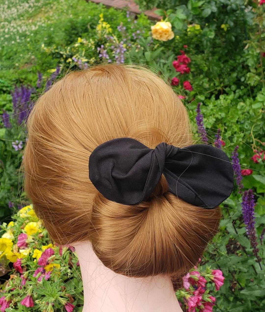 Image of Twisted ballerina bun under baseball cap