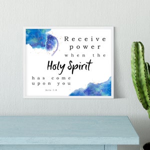 May include: A framed print with a watercolor background in shades of blue and gold. The text reads "Receive power when the Holy Spirit has come upon you. Acts 1:8"