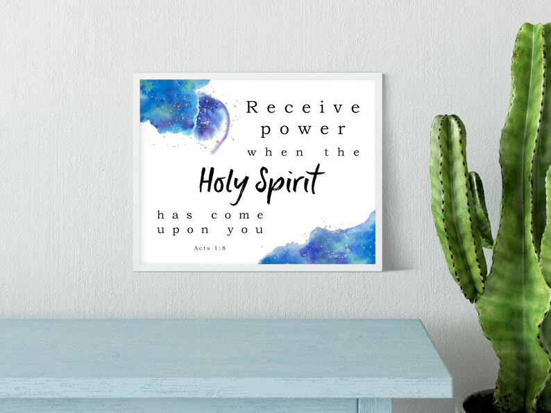 May include: A framed print with a watercolor background in shades of blue and gold. The text reads "Receive power when the Holy Spirit has come upon you. Acts 1:8"
