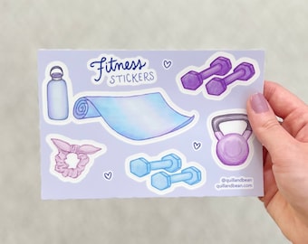 May include: A sheet of stickers with a light purple background featuring fitness themed illustrations. The stickers include a water bottle, a yoga mat, a kettlebell, two sets of dumbbells, and a hair scrunchie. The text "Fitness Stickers" is written in black cursive at the top of the sheet. The text "@quilandbean quilandbean.com" is written in black at the bottom of the sheet.