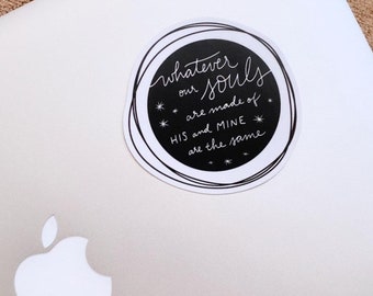 May include: A black and white round sticker with the text "Whatever our souls are made of HIS and MINE are the same" with stars around the text.