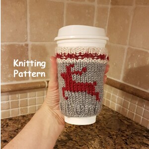 May include: Knitting pattern for a gray and red reindeer coffee cup cozy.