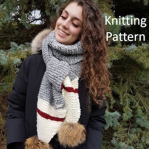 May include: A grey, white and burgundy striped scarf with two brown fur pom-poms. The scarf is knitted and has a textured pattern. The text "Knitting Pattern" is visible in the image.