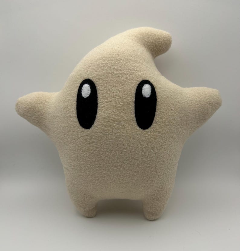 May include: A set of three ceramic mugs with a speckled, matte finish in cream, light grey, and dark grey. Each mug has a simple, minimalist design, suitable for coffee or tea.