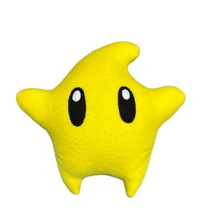 May include: A set of three ceramic mugs with a speckled, matte finish. The mugs are in shades of cream, light grey, and dark grey. Each mug has a simple, minimalist design and a rounded handle. The mugs are suitable for coffee, tea, or other beverages.