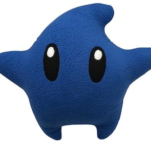 May include: A set of three ceramic canisters with lids. The canisters are white with a blue floral pattern. The largest canister is 20 cm tall, the medium is 15 cm, and the smallest is 10 cm.