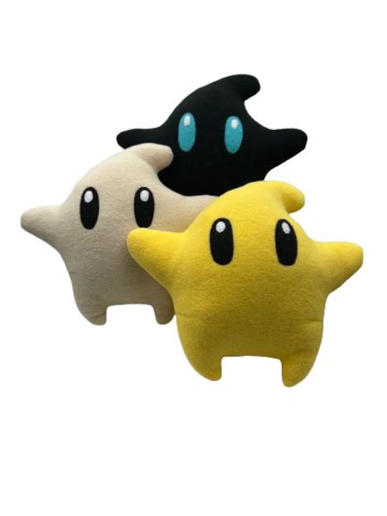 May include: A set of three ceramic mugs with a speckled, matte finish in cream, light grey, and dark grey. Each mug has a simple, minimalist design, suitable for coffee or tea.